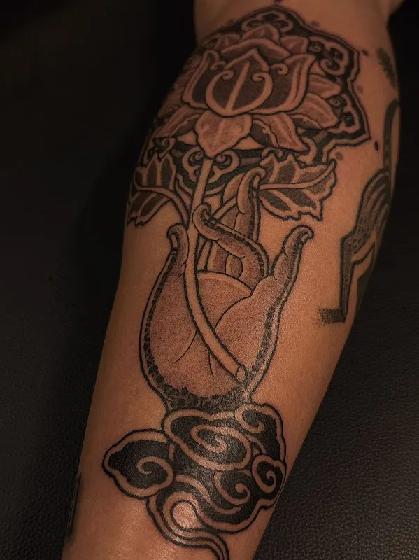 Sacred Bloom Tattoo
