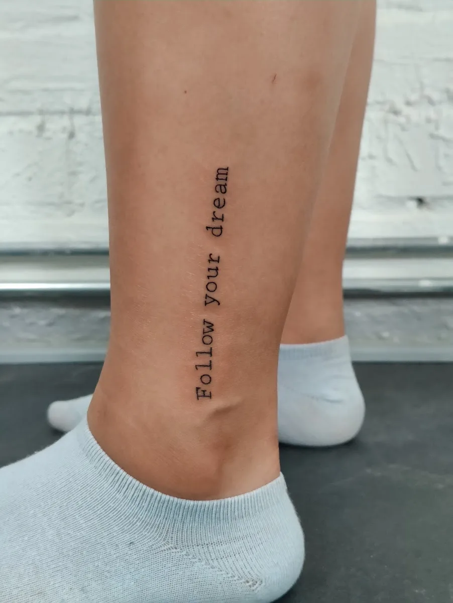 Fist of Needles Tattoo & Piercing