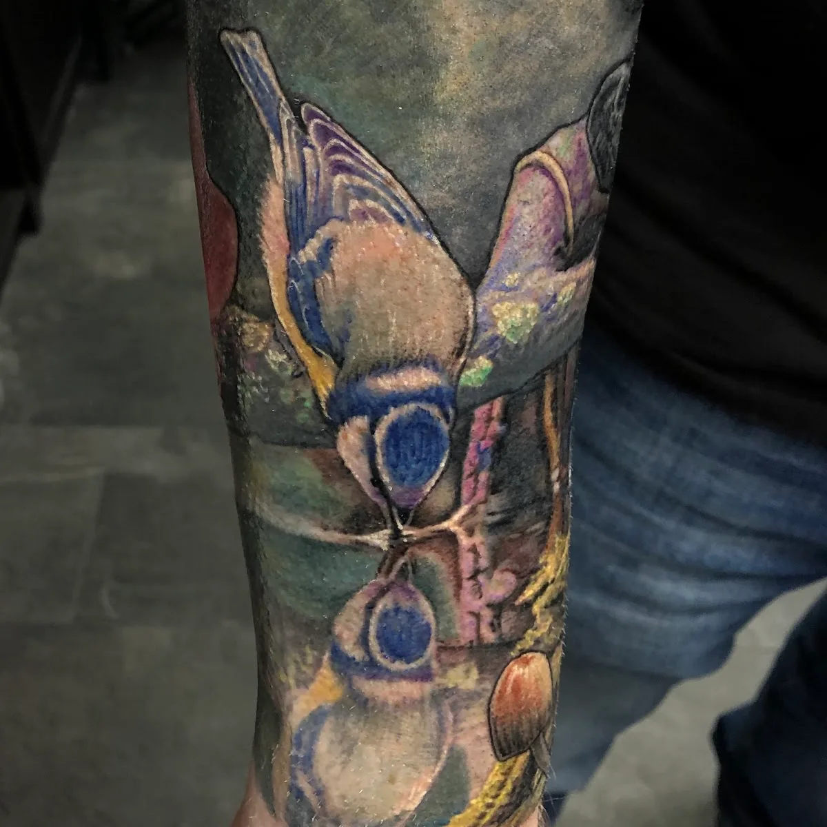 Fist of Needles Tattoo & Piercing