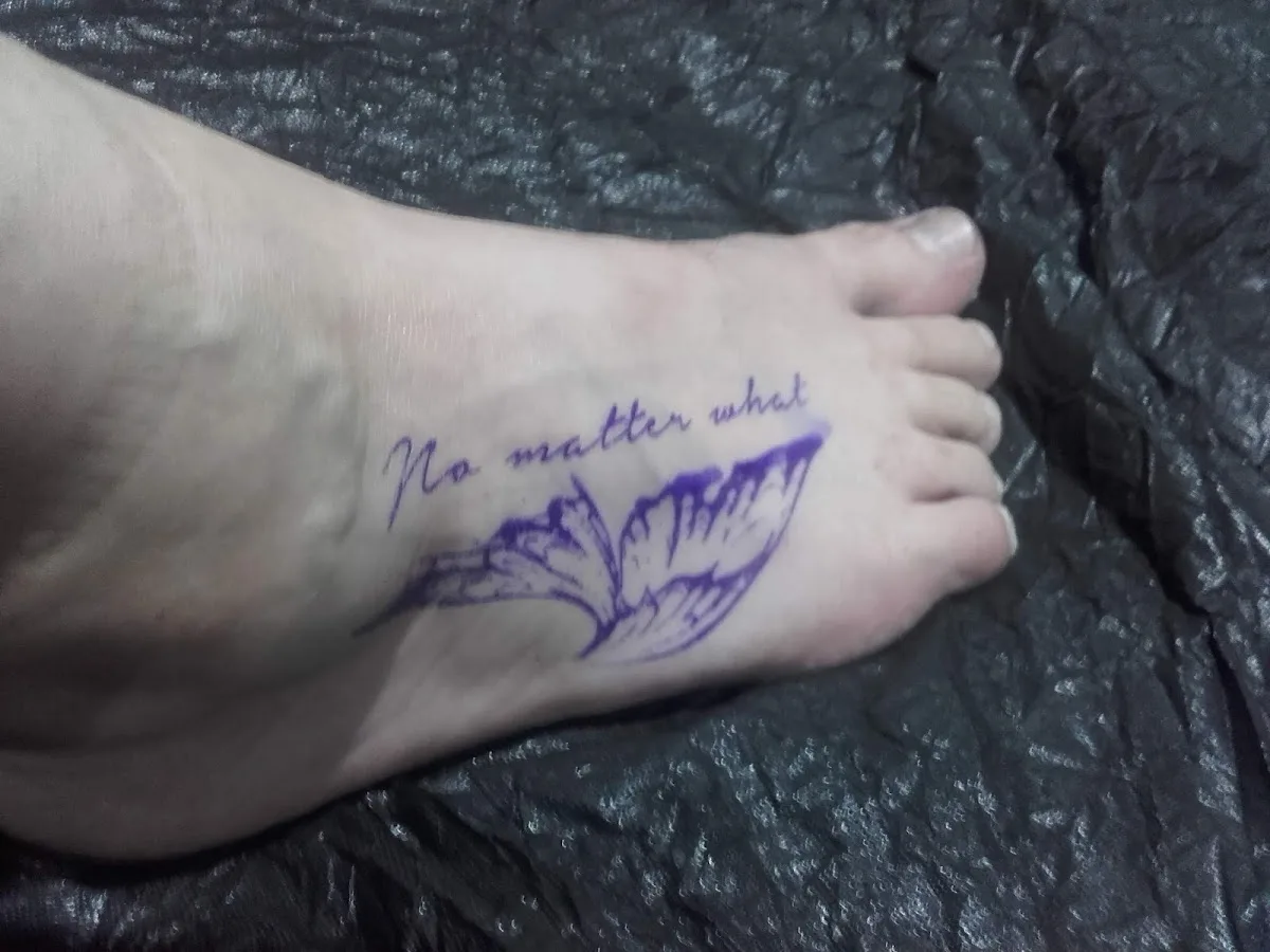 Fist of Needles Tattoo & Piercing