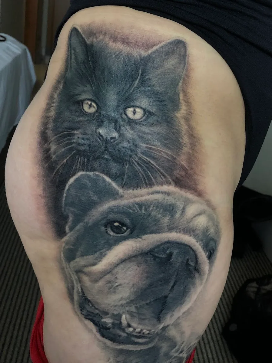 Fist of Needles Tattoo & Piercing