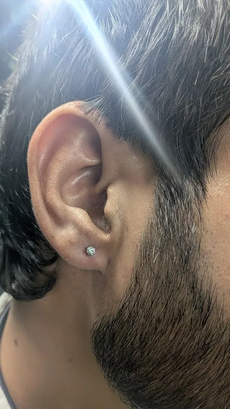 Sang’s tattoo and piercing