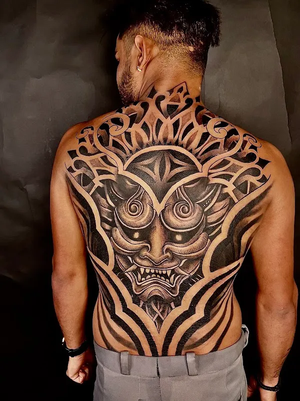 Sang’s tattoo and piercing