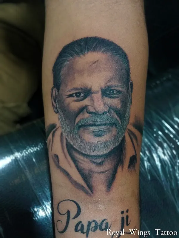 Royal wings tattoo