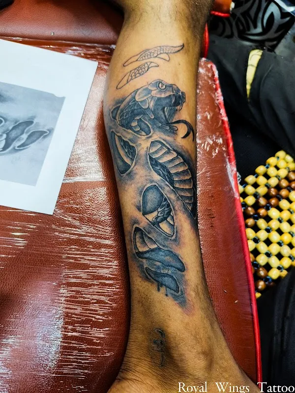 Royal wings tattoo