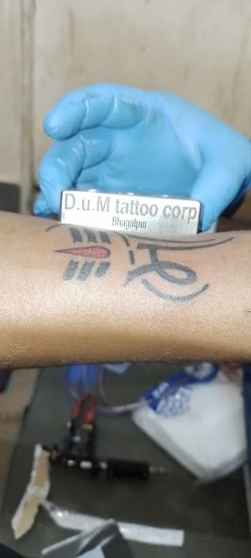 D U M Tattoo Corporation