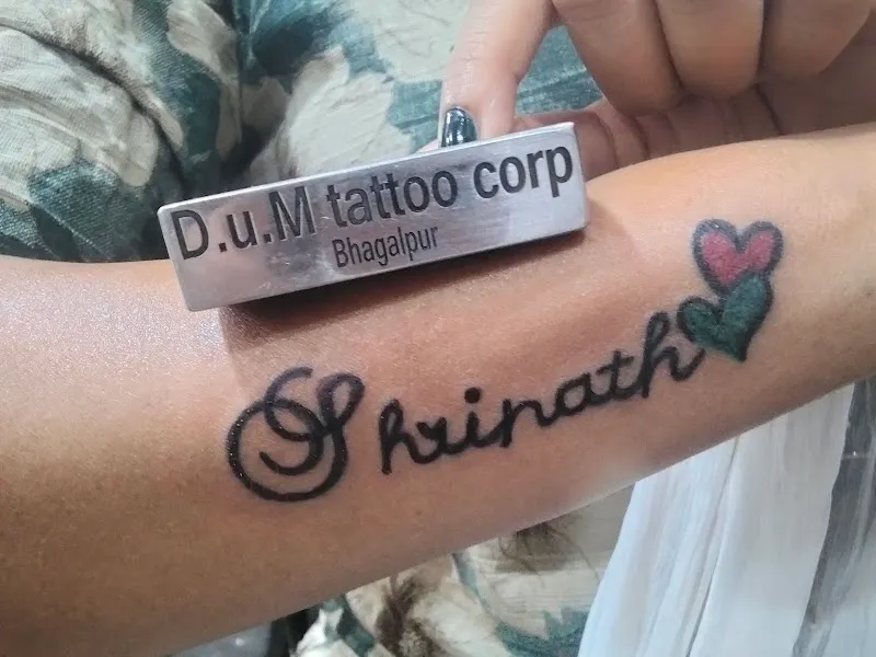 D U M Tattoo Corporation