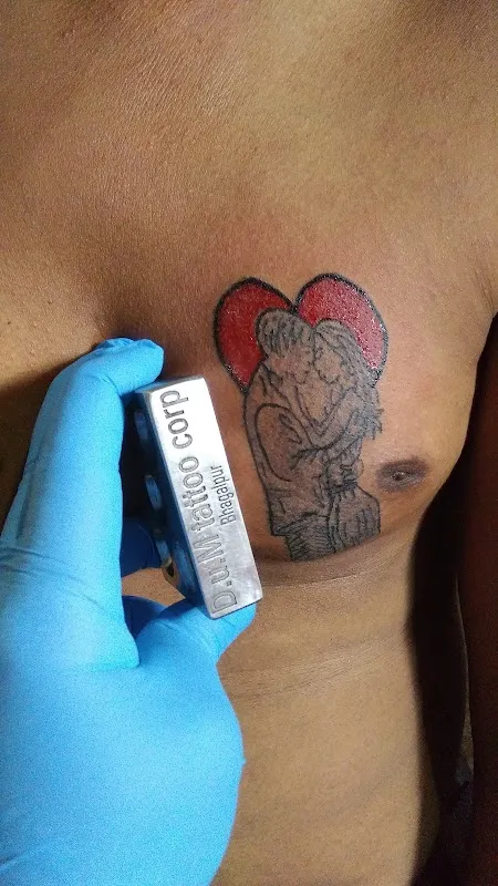 D U M Tattoo Corporation
