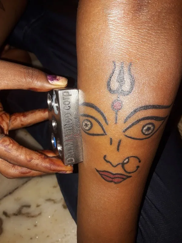 D U M Tattoo Corporation
