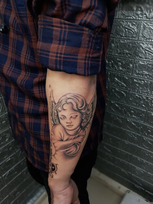 Needle Mantra Tattoo & Piercings