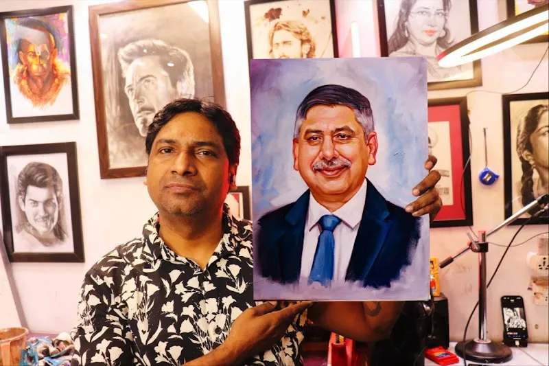 Sketch Artist With Portrait Painting