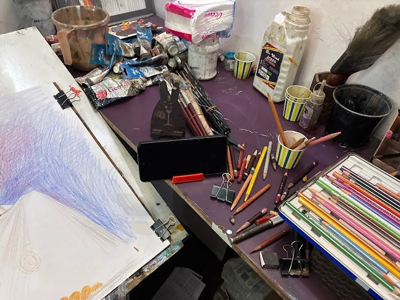 Sketch Artist With Portrait Painting