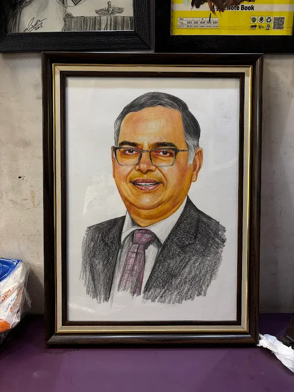 Sketch Artist With Portrait Painting
